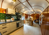 Goathland Camping Coach kitchen, with the living room in the background.