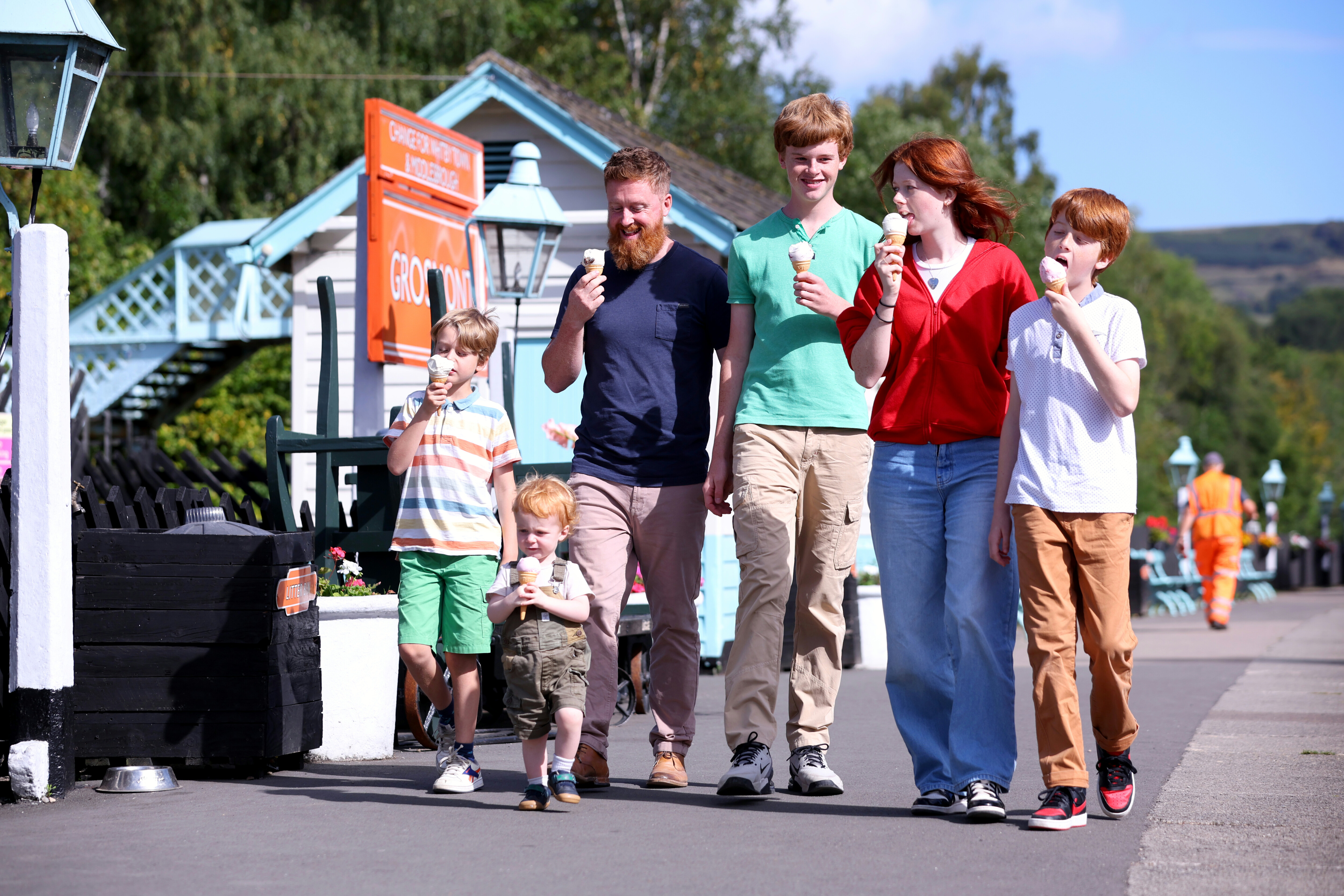 A family enjoy ice creams at Grosmont Station.