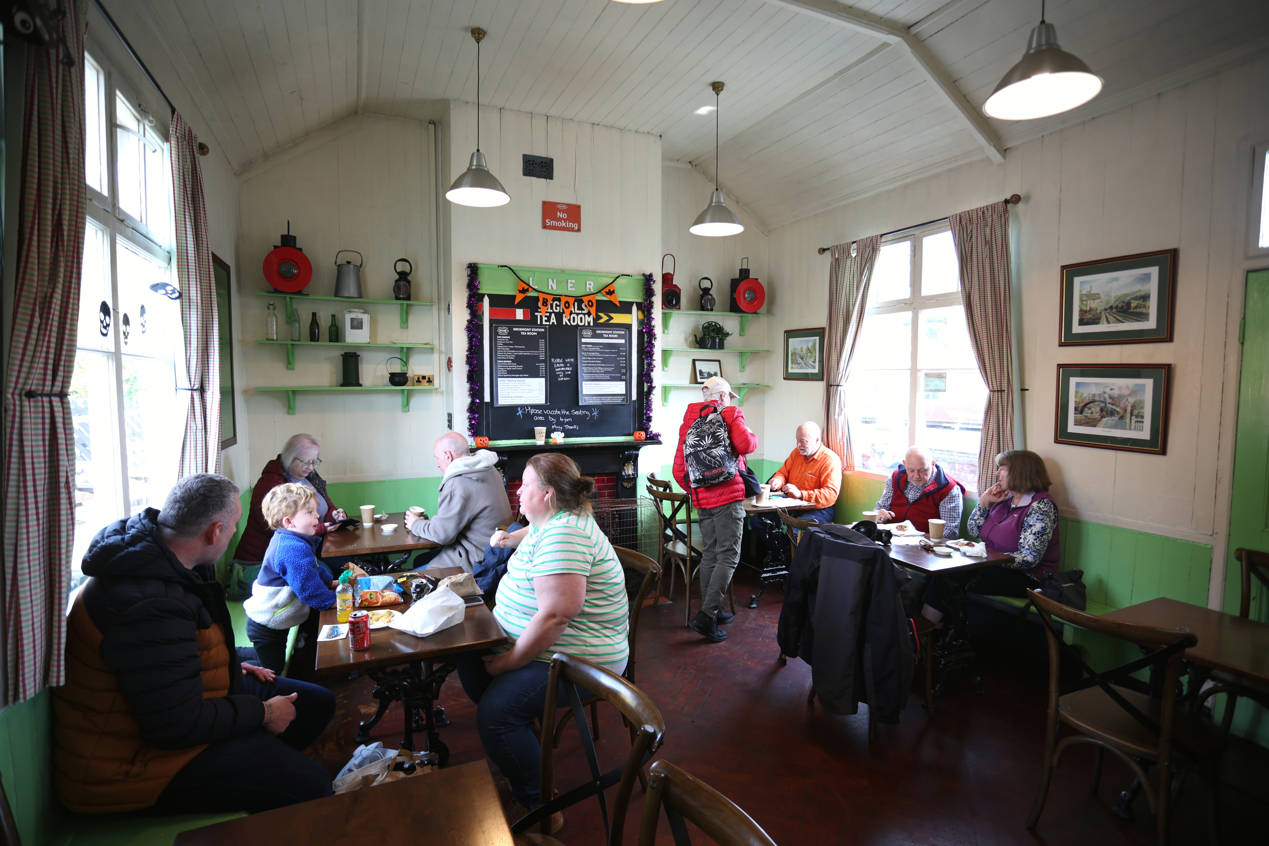 A busy view of people enjoying food and drink at Grosmont Station Tea Room.