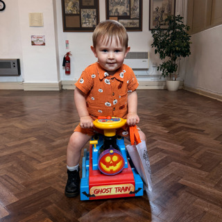 Child On Toy Ghost Train