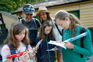 Family with trail maps