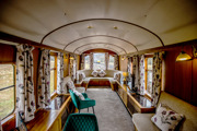 Levisham Camping Coach living room, with views of the railway line out of the window.
