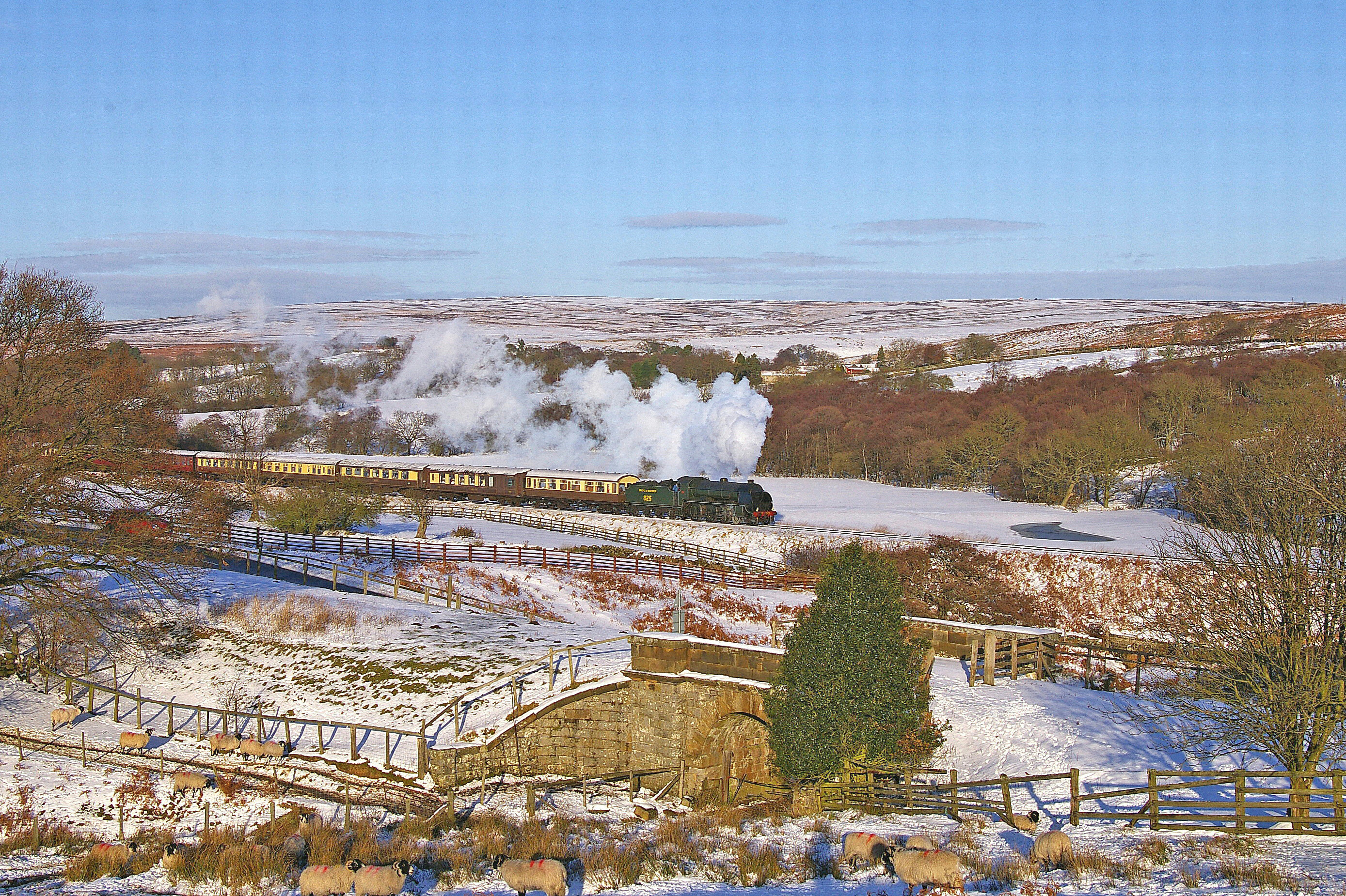 The North Yorkshire Pullman traverses the snow sprinkled landscape.