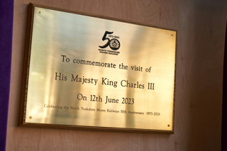 A plaque commemorating the visit of King Charles III celebrating he 50th Anniversary of the North Yorkshire Moors Railway.