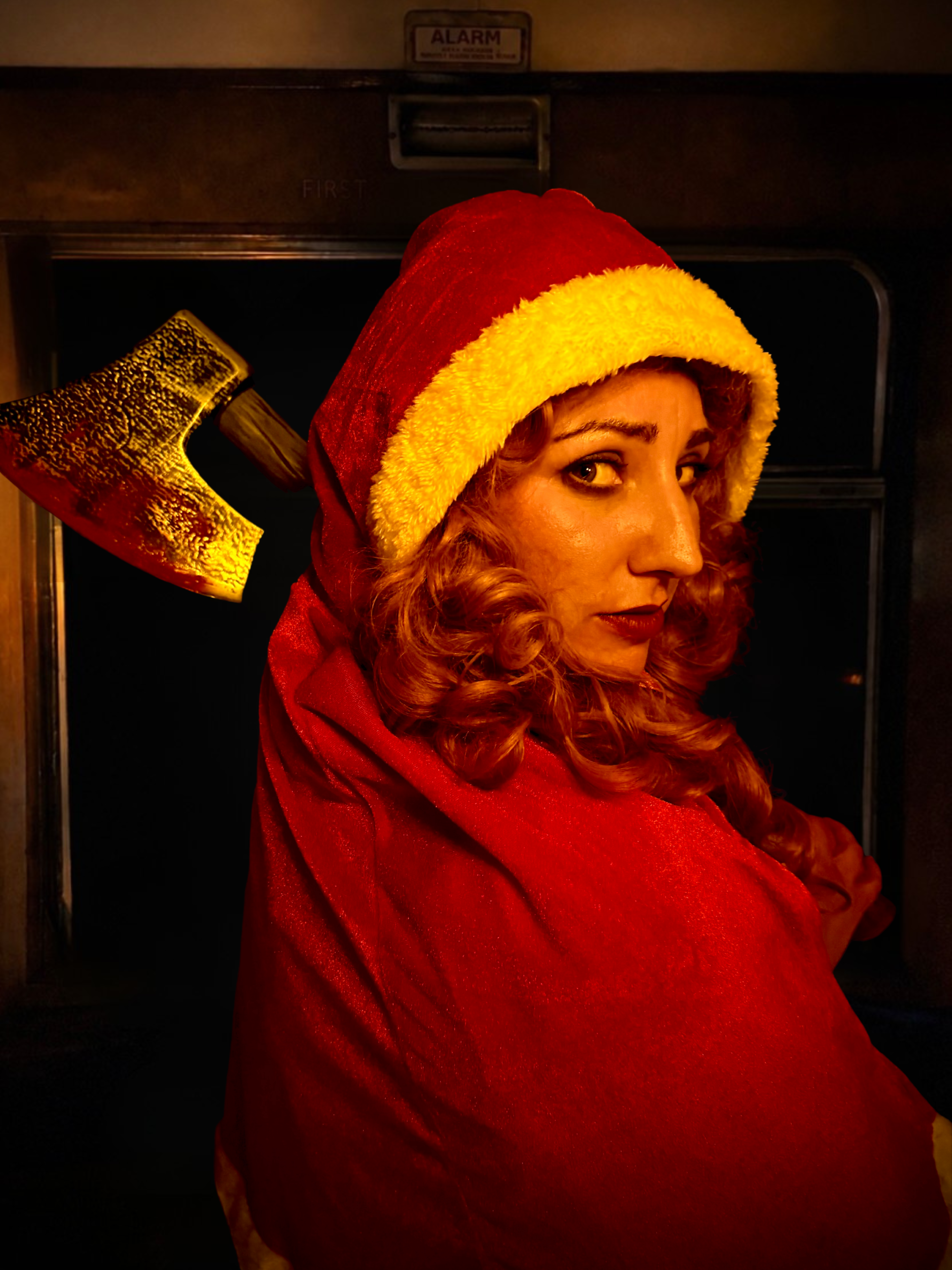 Mad Alice peers over her shoulder, shes brandishing a bloody axe.