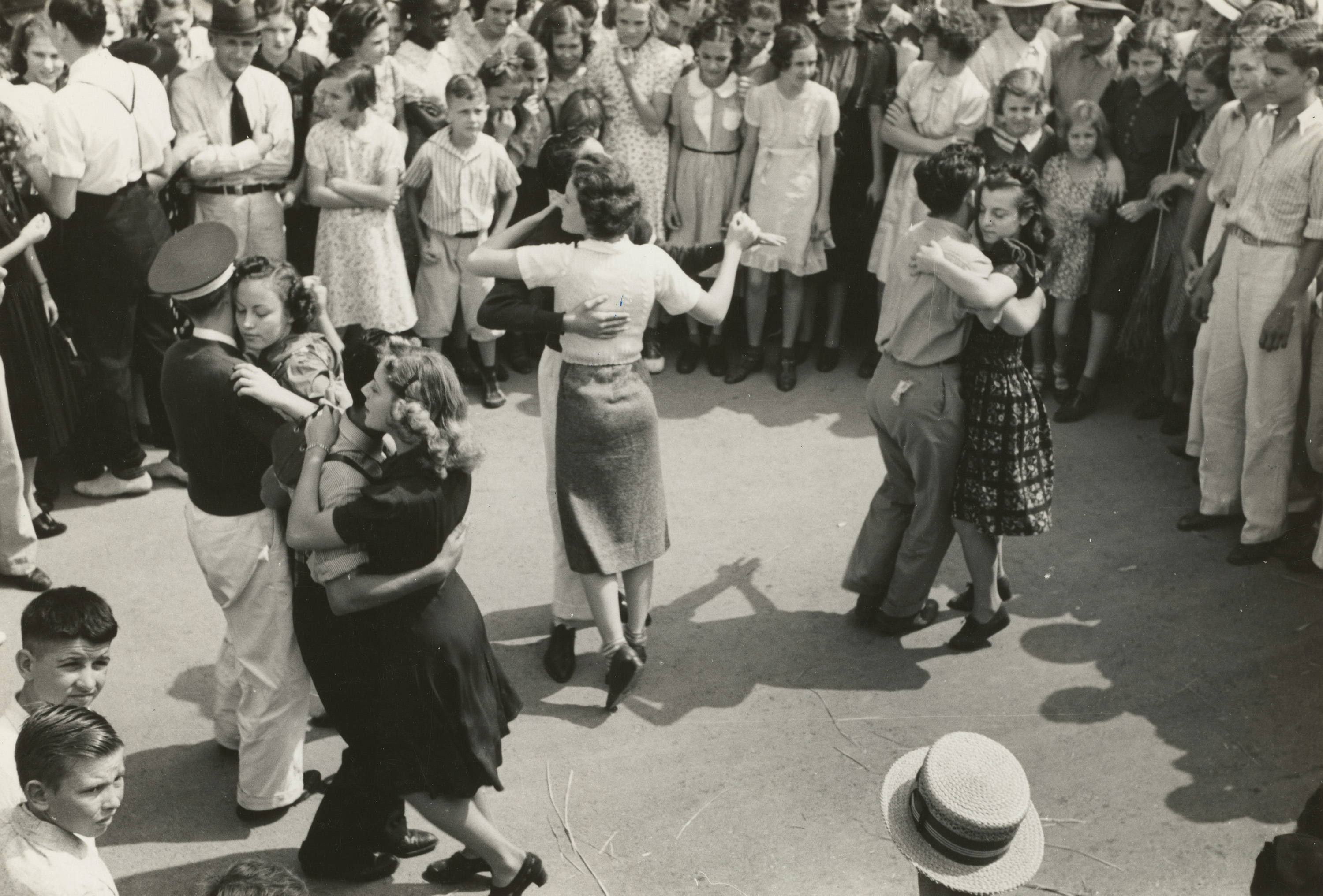 A black and white photo of a street dance, National Rice Festival, Crowley, Louisiana. Photographer Russell Lee.