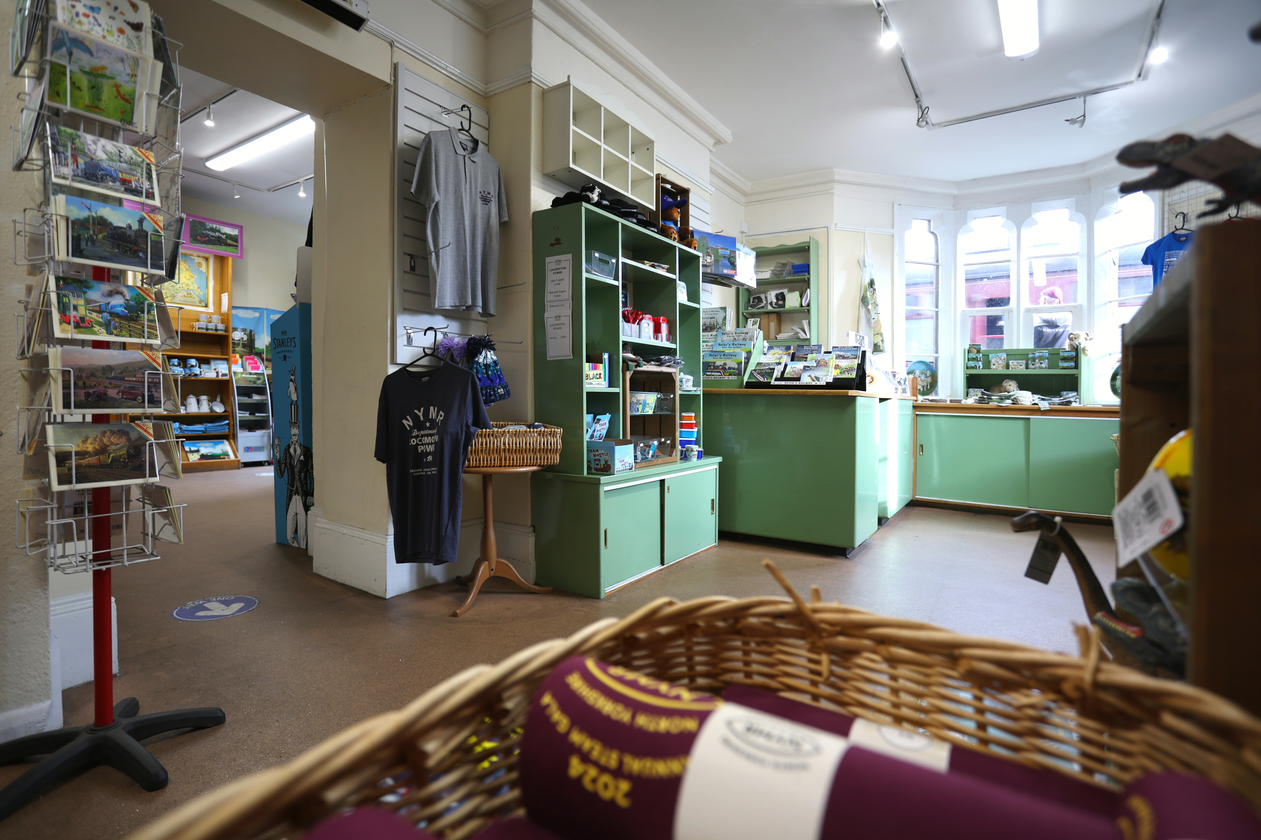 A wide view of Goathland Station Gift Shop, showing the level route and wheelchair accessible counter.