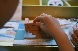 Child building with bricks